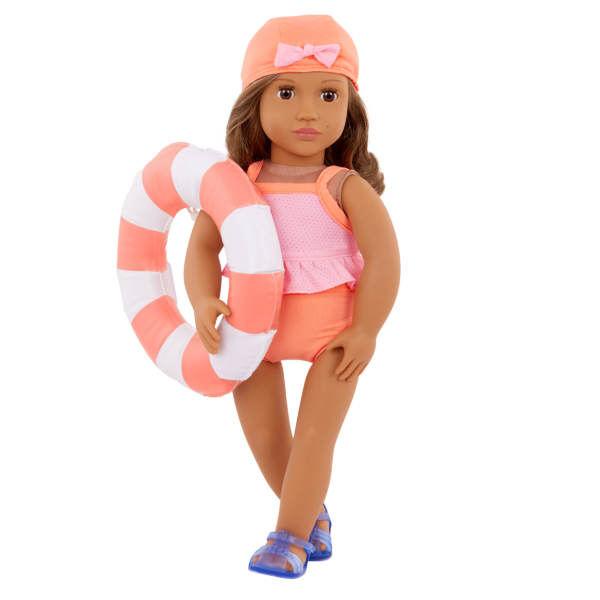 Our Generation Doll wearing the Deluxe Outfit "Floaty Fun" and holding a donut shaped floatie