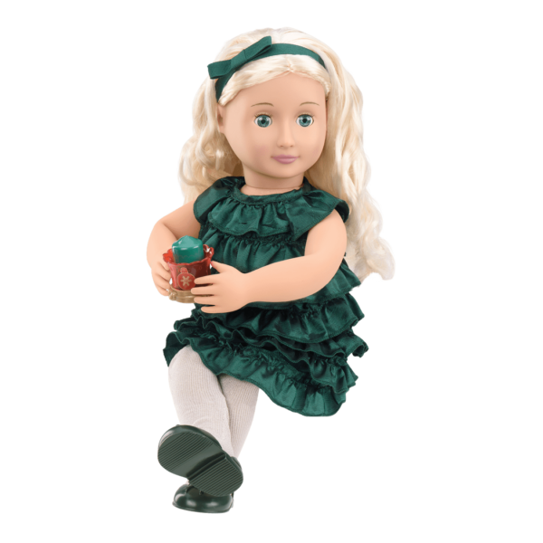 Girl holding Audrey Ann doll and reading storybook