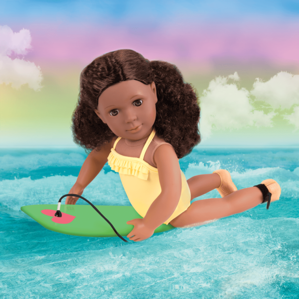 Dedra riding boogie board in water