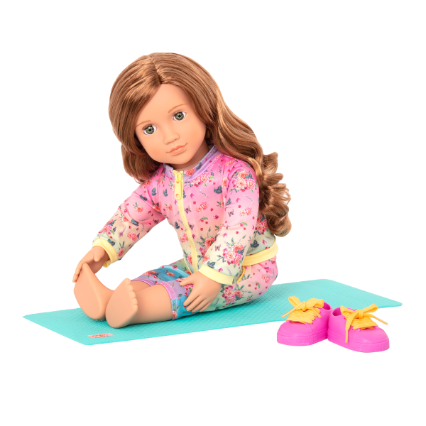 Lucy Grace stretching on yoga mat