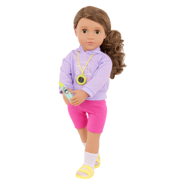 Our Generation 18 inch Doll Vivian holding a bug spray with compass around her neck