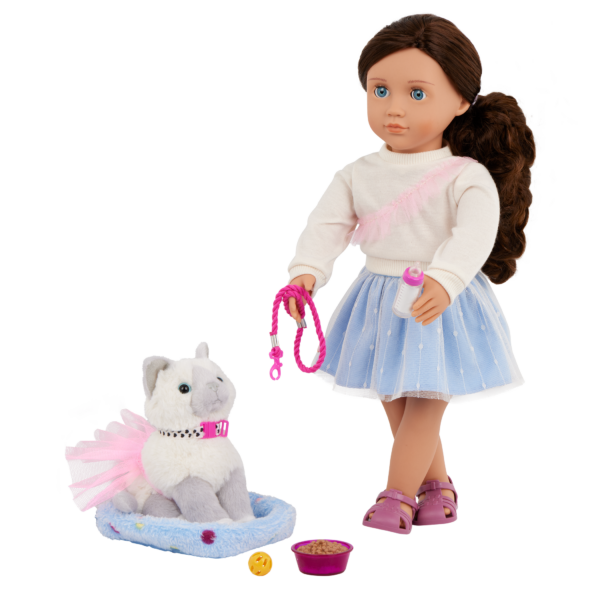 Our Generation 18" Doll Mindy with her Pet Cat Pepper sitting in her bed, wearing a skirt