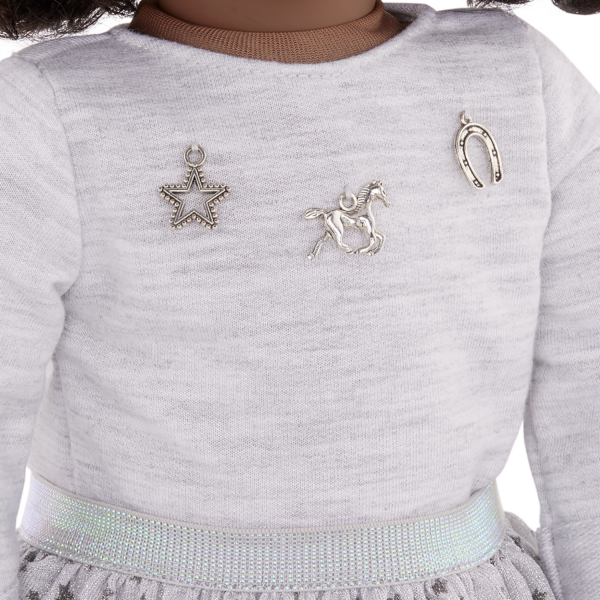 Close up of Our Generation 18 inch Doll Victoria wearing sweater with horse charms