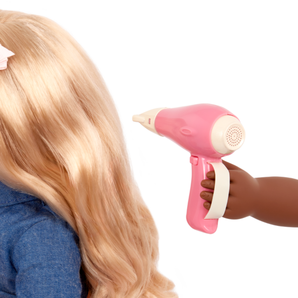 An Our Generation Doll blow drying the hair on another doll