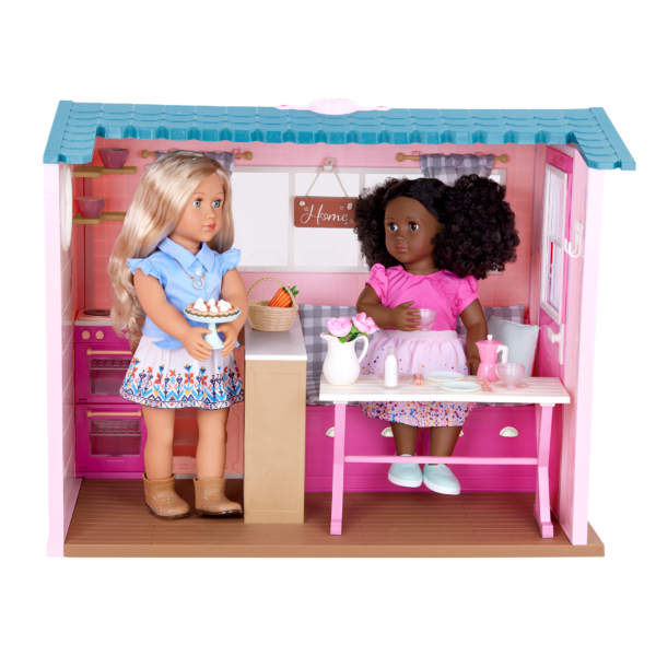 Two Our Generation 18-inch Dolls in the Country House set up as a kitchen and dining room