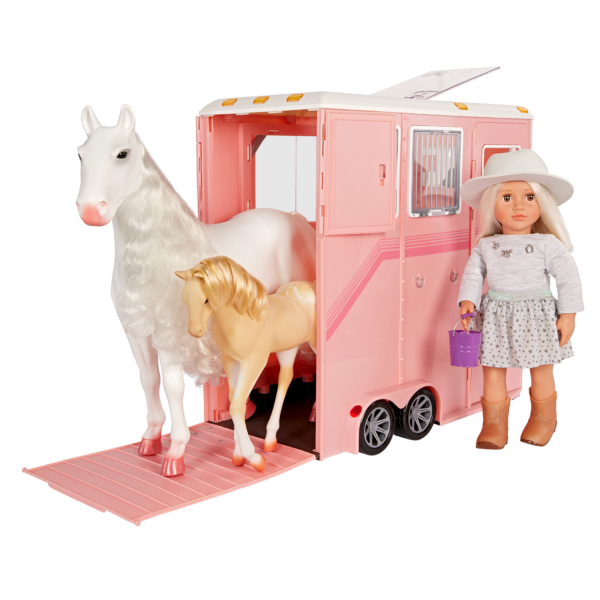 Our Generation 18 inch Doll beside horse trailer and 2 horses in the Trailer with accessories