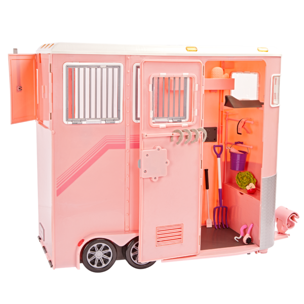 Side of the horse trailer with door open and tools inside