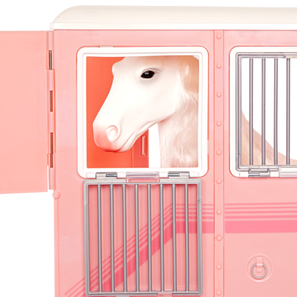 Horse trailer with horse peeking his head out the window