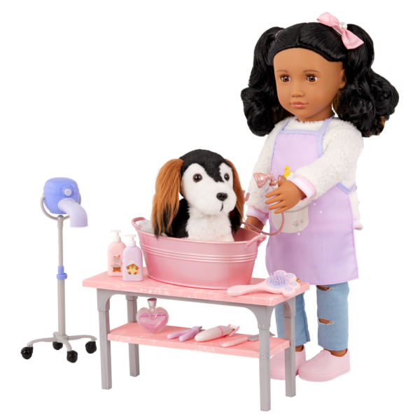 Our Generation 18 inch Doll washing dog in bathtub on table