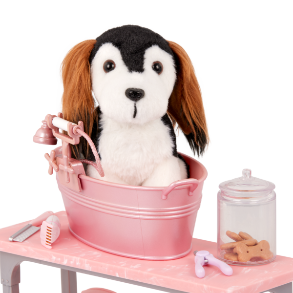 Our Generation dog in bathtub on grooming table with dog treats and grooming tools