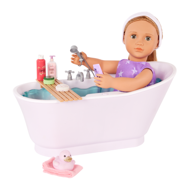 Our Generation 18-inch Doll sitting in Bathtub with bath accessories