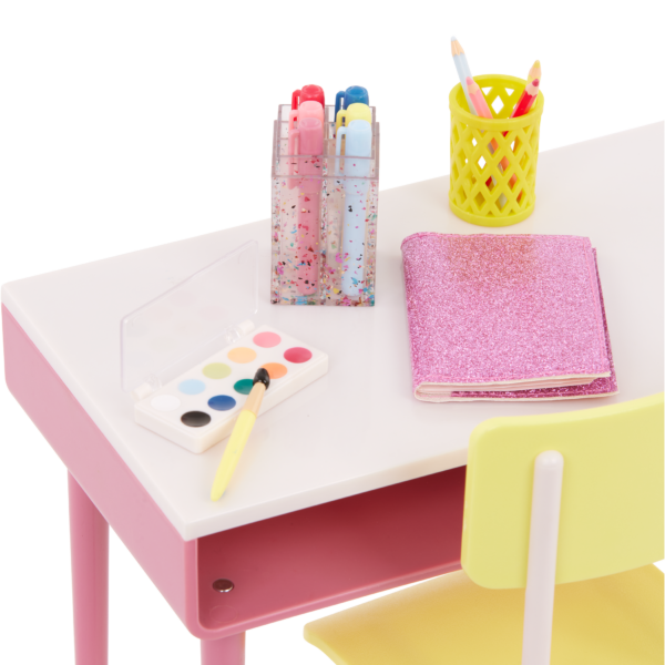 Close Up of Our Generation Desk with accessories including paints, markers, notebook and pencil holder