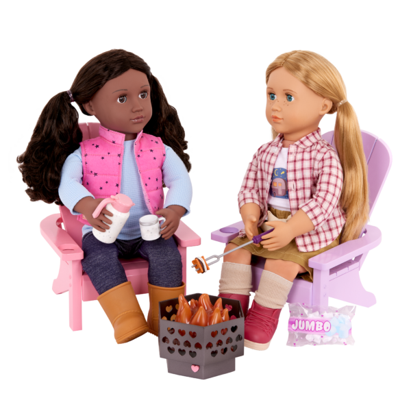 Two Our Generation Dolls sitting on the Adirondack Chairs with fire pit and roasting marshmallows