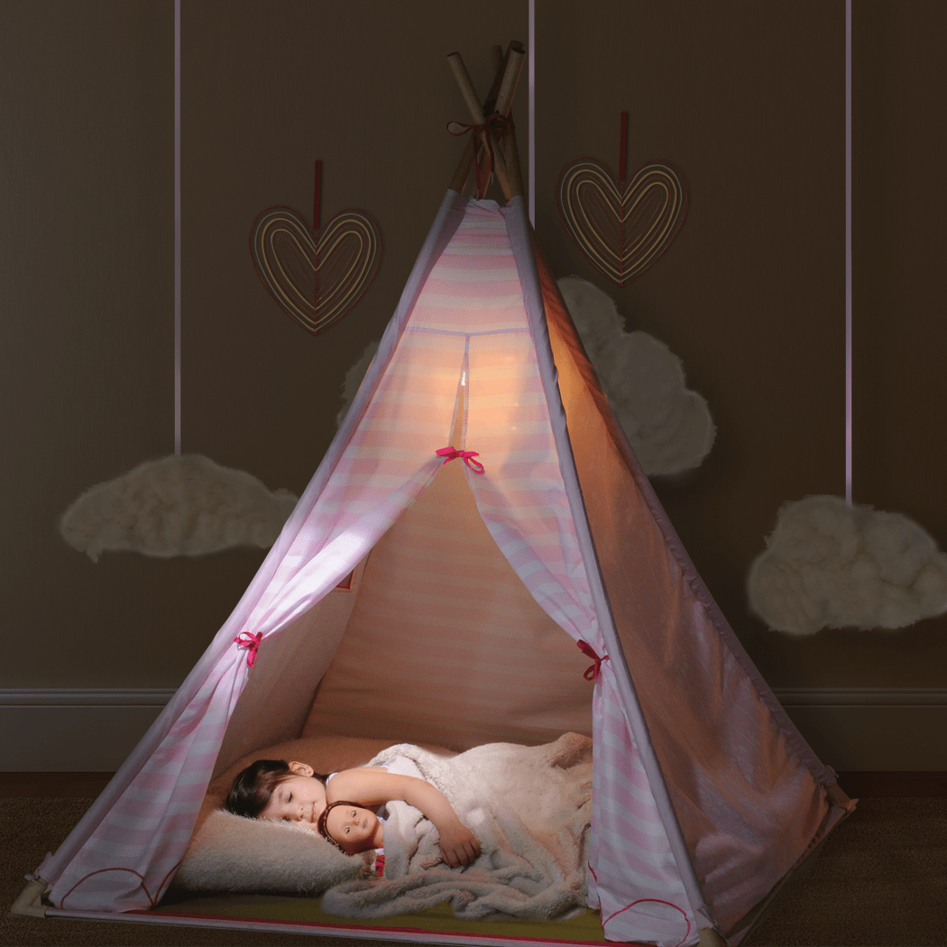 Girl sleeping at night in Suite Teepee with doll