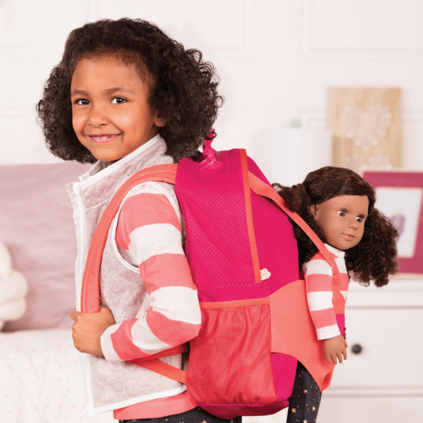 Girl wearing Hop On Carrier Backpack Bright Dots with Denelle in harness