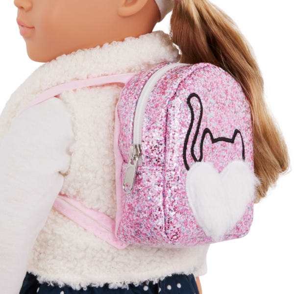 Our Generation Doll wearing a pink cat sparkly backpack